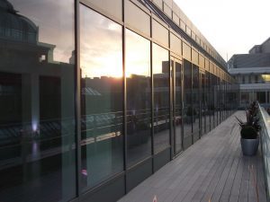 Curtain Walling sections coated with colour matched doors and aluminium panels. 