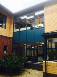 Blue panels in curtain walling. 