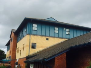 Faded aluminium windows and panels.